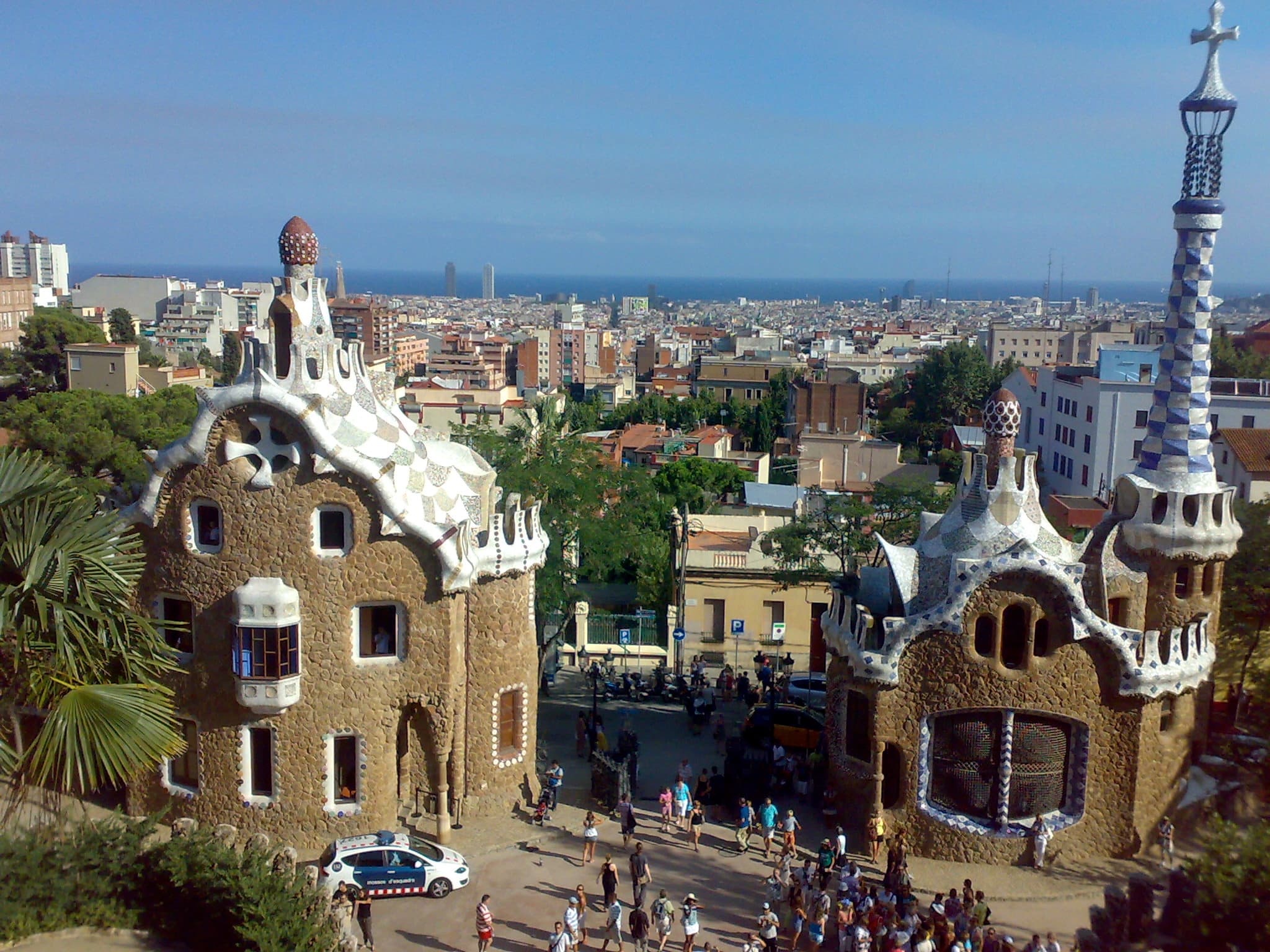 The mosaic-tiled terrace and colourful trencadís benches of Park Güell overlooking Barcelona
