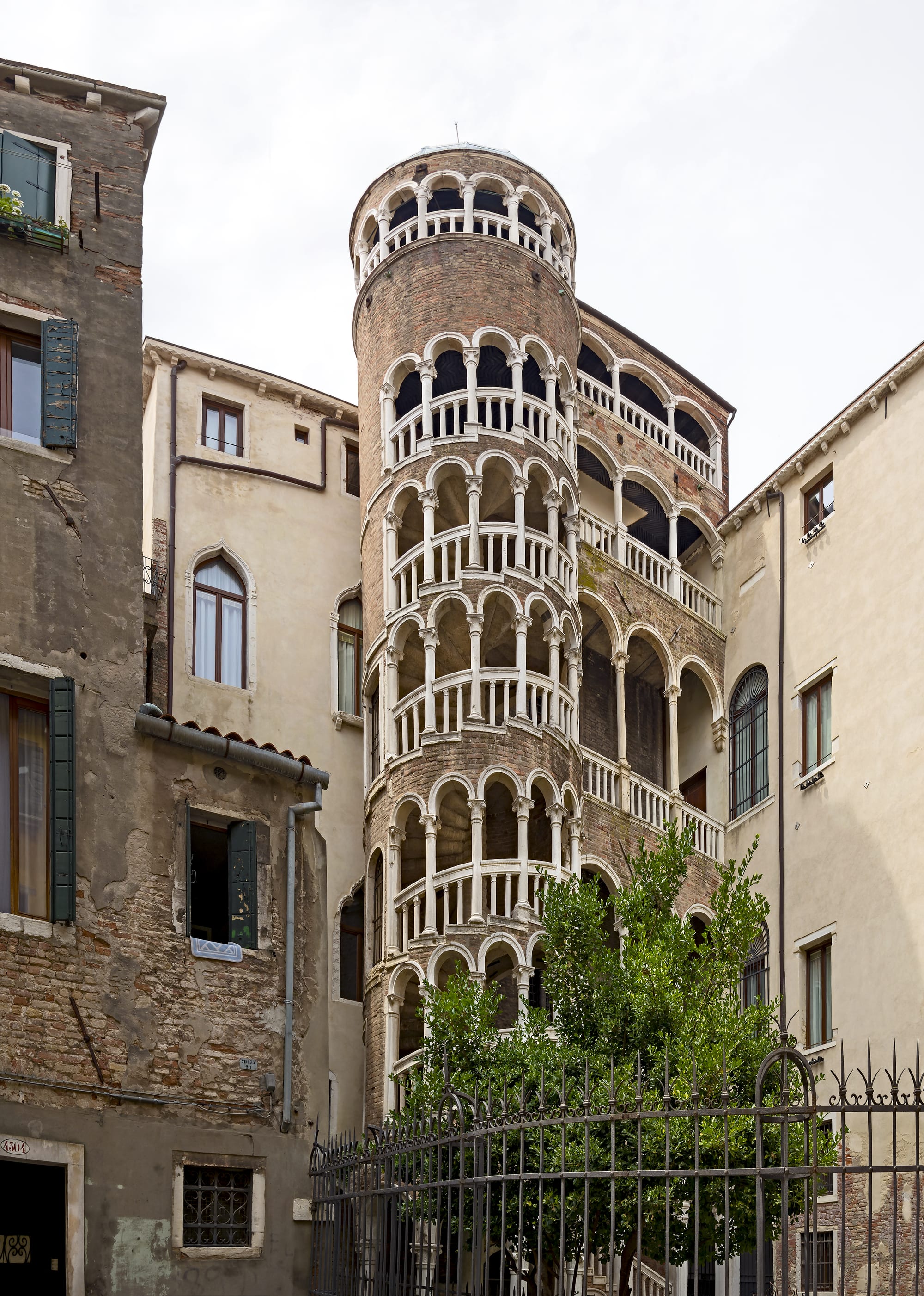 The spiral brick arches of the Scala Contarini del Bovolo staircase in Venice